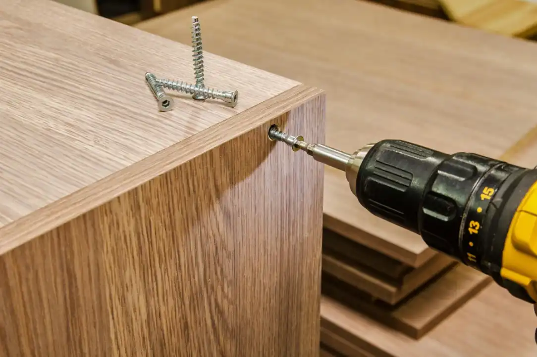 picture of a drill going into a box